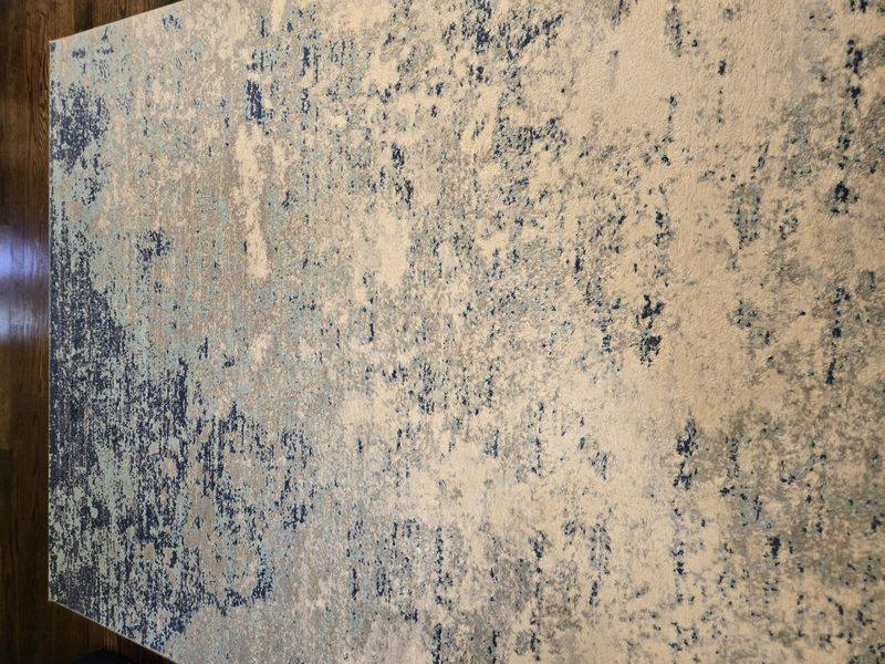 Cleaned blue and cream area rug
